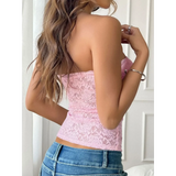 Babe Beachwear pink strapless lace crop top worn with blue jeans showcasing back view