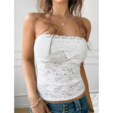 Babe Beachwaer white strapless lace crop top worn with blue denim jeans