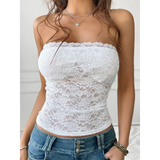 Babe Beachwear white strapless lace crop top worn with blue denim jeans