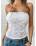 Babe Beachwear white strapless lace crop top worn with blue denim jeans