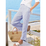 Striped beach pants for women by Babe Beachwaer in blue and white paired with white sandals