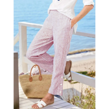 Striped beach pants for women by Babe Beachwear in red and white with side button details