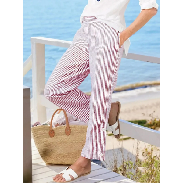 Striped beach pants for women by Babe Beachwear in red and white with side button details