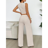 Babe Beachwear striped knit vest and pants set featuring sleeveless top and wide-leg pants in beige and white