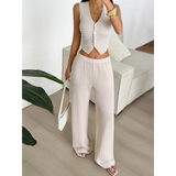 Babe Beachwear striped knit vest and pants set in light beige worn with white handbag and sandals