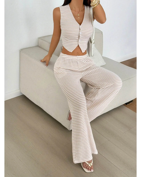 Babe Beachwear striped knit vest and pants set in beige and white worn by model sitting on couch