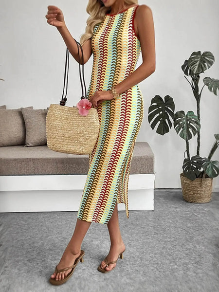Babe Beachwear striped midi beach dress with multicolor pattern worn with straw bag and sandals