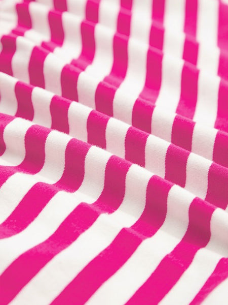 Close-up of EG fashion striped midi dress summer fabric with pink and white stripes