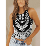Trendsi sleeveless black and white floral patterned stylish crop top worn with light denim shorts