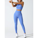 Trendsi stylish high waisted gym leggings set in blue with matching crop top and white sneakers