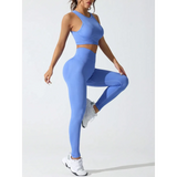 Trendsi stylish high waisted gym leggings set in light blue with matching crop top and white sneakers