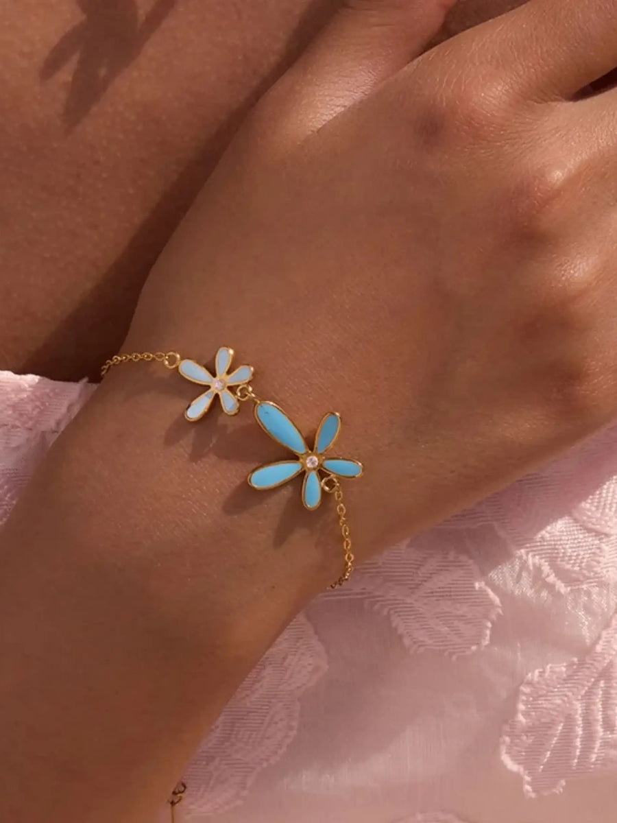 Trendsi summer beach necklace and bracelet set with gold chain and blue white flower charms on wrist