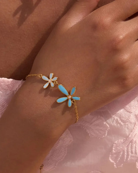 Trendsi summer beach necklace and bracelet set with gold chain and blue white flower charms on wrist