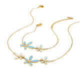 Trendsi gold jewelry set featuring summer beach necklace and bracelet with blue and white flower charms