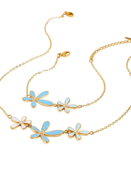 Trendsi gold jewelry set featuring summer beach necklace and bracelet with blue and white flower charms