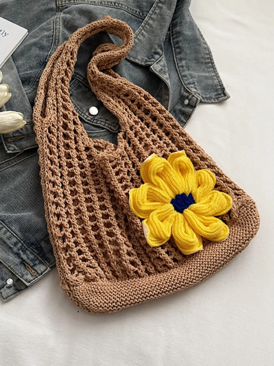 Babe Beachwear summer crochet tote 2025 in brown with yellow flower detail on denim background