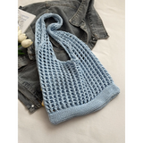 Babe Beachwear light blue summer crochet tote 2025 bag with open knit design on denim jacket