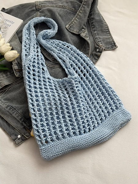 Babe Beachwear light blue summer crochet tote 2025 bag with open knit design on denim jacket