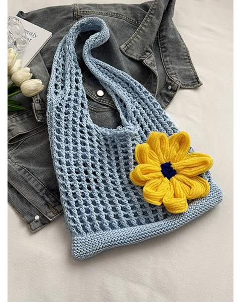 Babe Beachwear summer crochet tote 2025 in light blue with a large yellow flower accessory