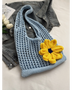Babe Beachwear summer crochet tote 2025 in light blue with a large yellow flower accessory