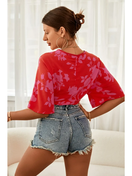 Babe Beachwear of woman wearing summer floral tie front blouse in red with purple floral pattern