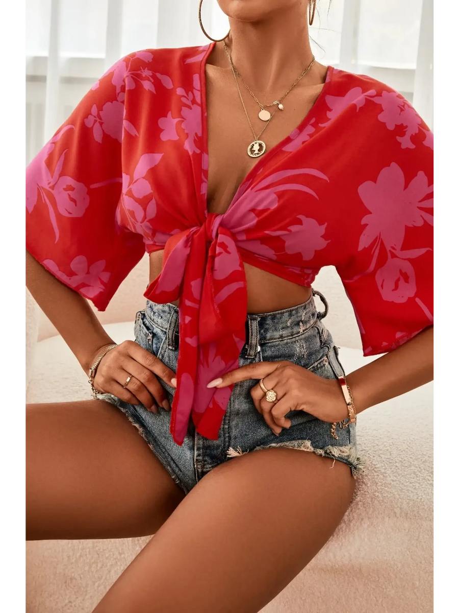 Babe Beachwear summer floral tie front blouse in red with pink flowers styled with denim shorts