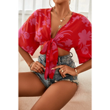 Babe Beachwear summer floral tie front blouse in red with pink flowers styled with denim shorts