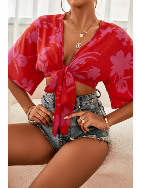Babe Beachwear summer floral tie front blouse in red with pink flowers styled with denim shorts