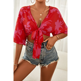 Babe Beachwear summer floral tie front blouse in red with purple flowers paired with denim shorts