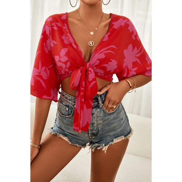 Babe Beachwear summer floral tie front blouse in red with purple flowers paired with denim shorts