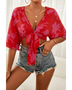 Babe Beachwear summer floral tie front blouse in red with purple flowers paired with denim shorts