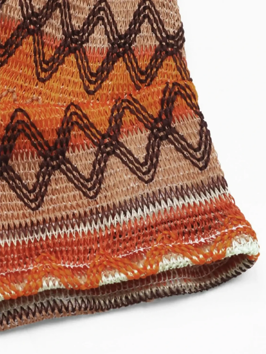Close-up of Babe Beachwear Summer Halter boho crochet crop top in orange and brown tones