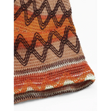 Close-up of Babe Beachwear Summer Halter boho crochet crop top in orange and brown tones