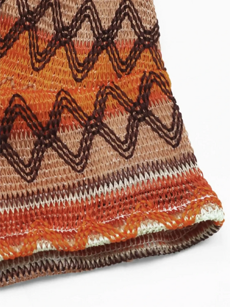 Close-up of Babe Beachwear Summer Halter boho crochet crop top in orange and brown tones