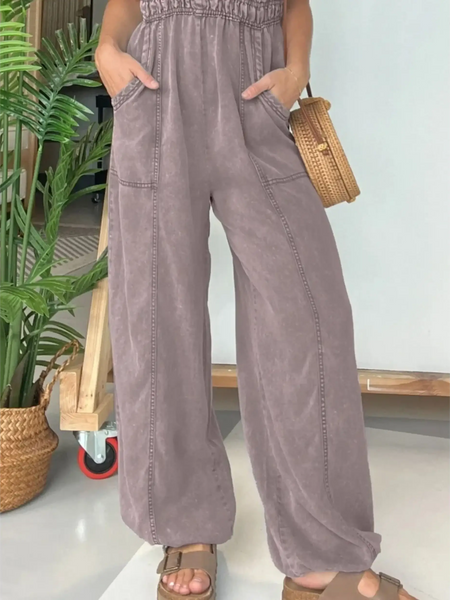 Babe Beachwear spaghetti strap summer jumpsuit in soft purple with wide legs and front pockets