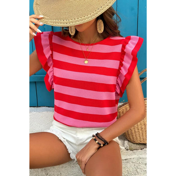 Sleeveless striped ruffle sleeve summer top in red and pink worn with white shorts