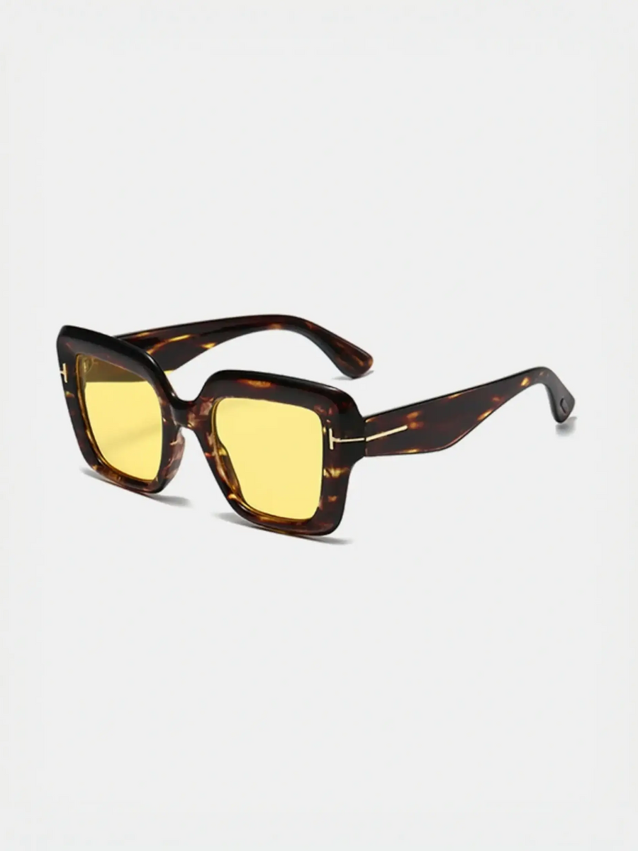 Tortoiseshell sunglasses with yellow lenses perfect for beach vacations and stylish beach styles