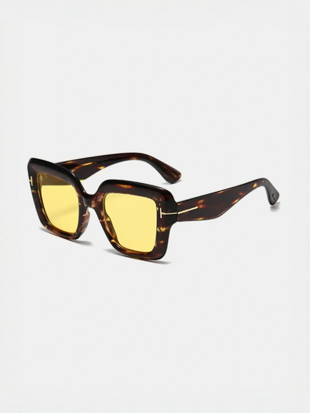 Tortoiseshell sunglasses with yellow lenses perfect for beach vacations and stylish beach styles