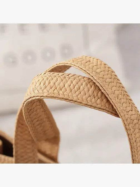 Close-up of woven straps on a Babe Beachwear Super Boho Fringe Woven Tote bag in natural beige color
