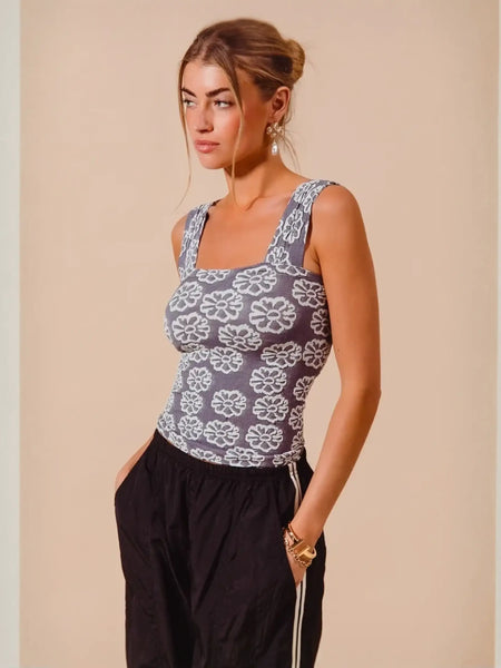 Woman wearing a floral-patterned tank top from Bloom in Style Gray Collection