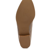 Sole view of Rag Company black genuine leather loafers showing textured brown outsole and heel