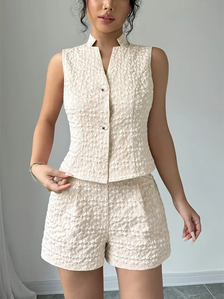 Textured resort vest and short set in cream featuring sleeveless button-up vest and high-waist shorts