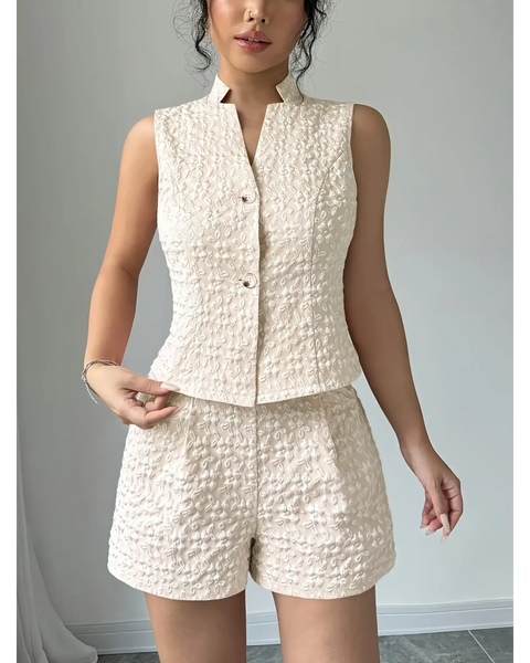 Textured resort vest and short set in cream featuring sleeveless button-up vest and high-waist shorts