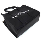 Fashion World large beach tote bag for women in black with bold white lettering and sturdy handles