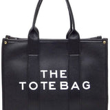 Black large beach tote bag for women with sturdy handles and spacious interior by Fashion World