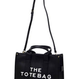 Fashion World large beach tote bag for women in black with long adjustable strap and short handles