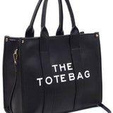 Fashion World large beach tote bag for women in black with sturdy handles and detachable shoulder strap