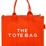 Fashion World large beach tote bag for women in bright orange with double handles and bold white text