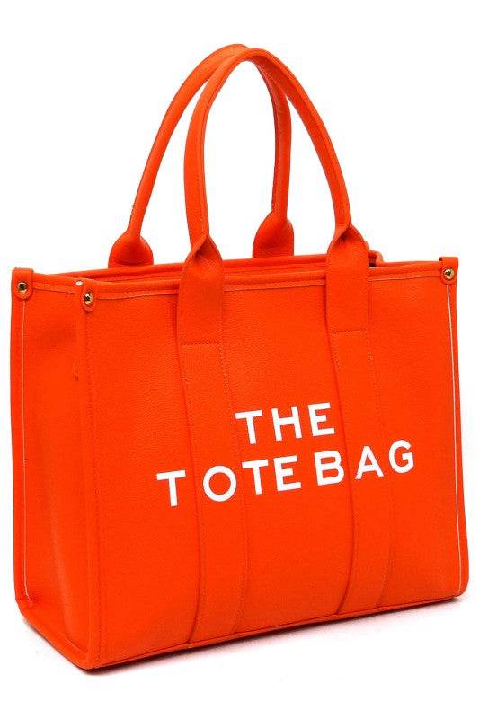 Fashion World large beach tote bag for women in bright orange with sturdy handles and bold white text