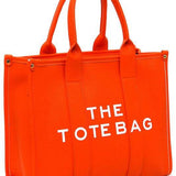 Fashion World large beach tote bag for women in bright orange with sturdy handles and bold white text